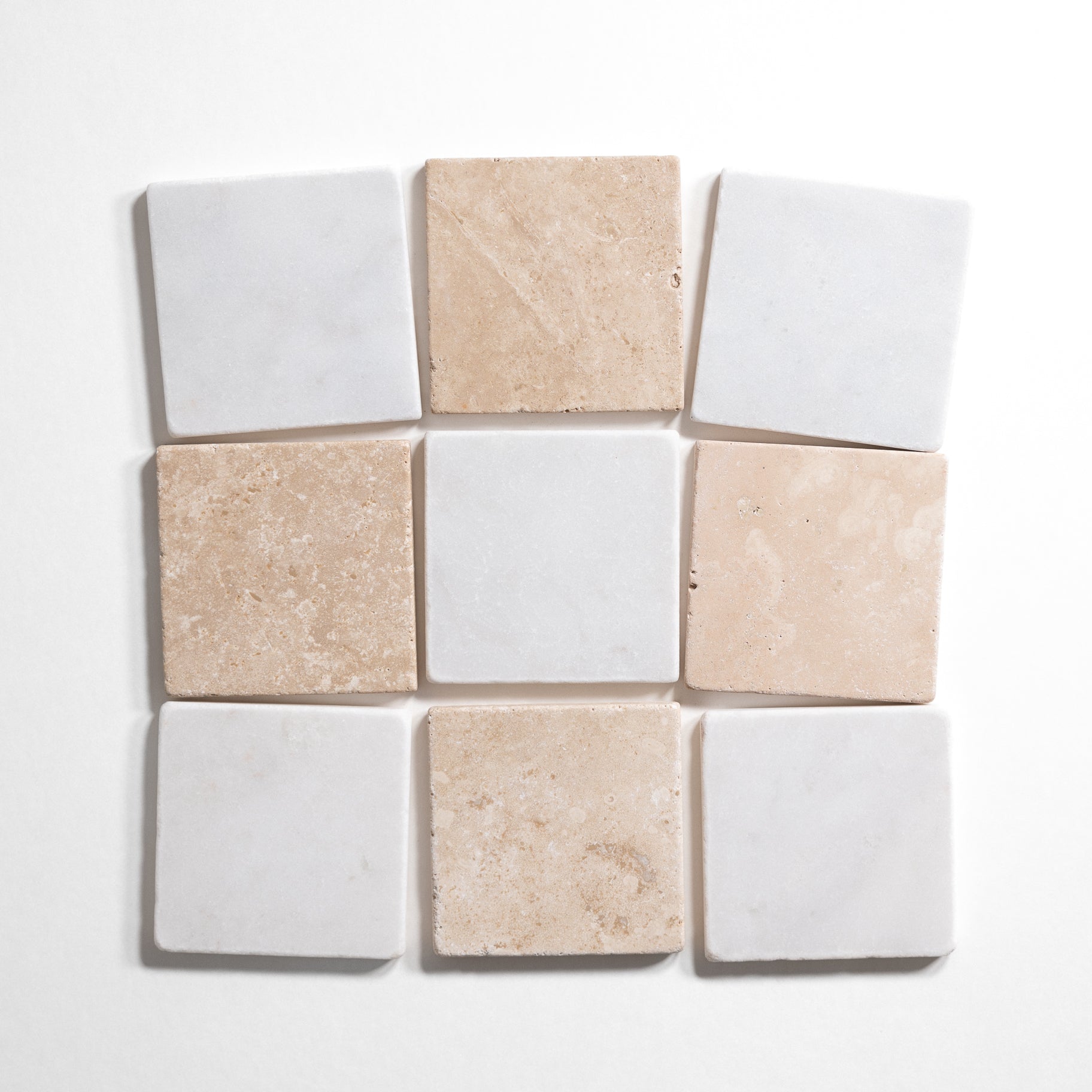 Beige and white tumbled marble checkered tile pattern in 4x4 squares