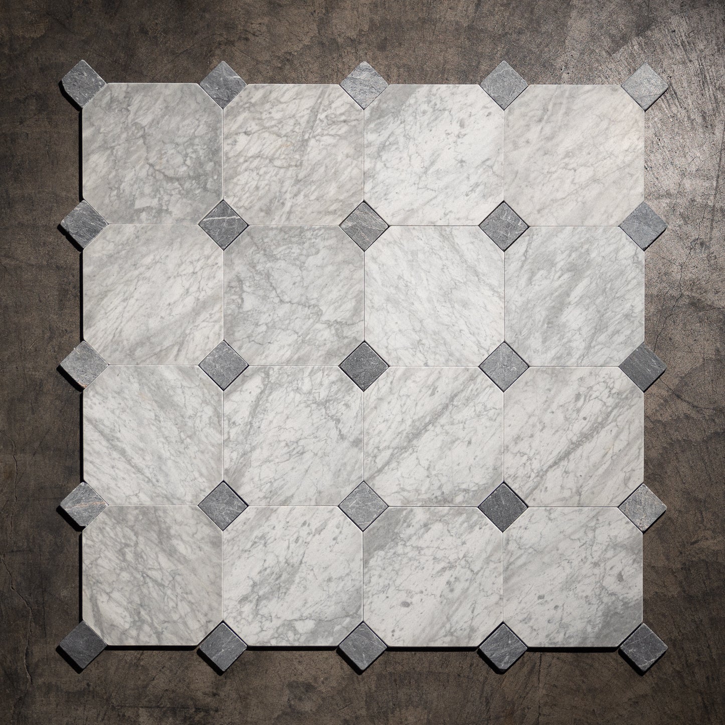 Carrara Gioia 12" Octagon tumbled marble tile with blue dot