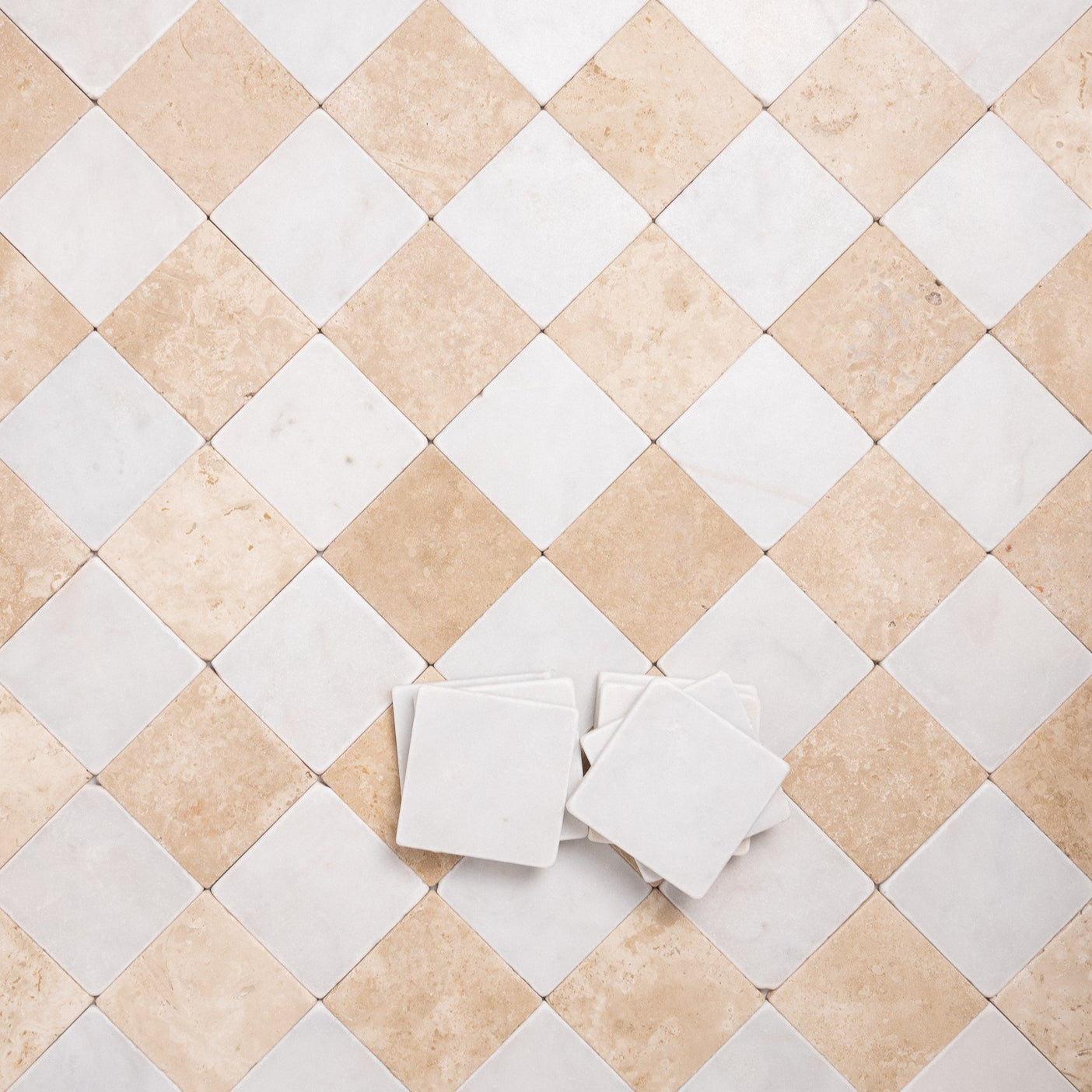 Beige and white tumbled marble checkered tile pattern in 4x4 squares