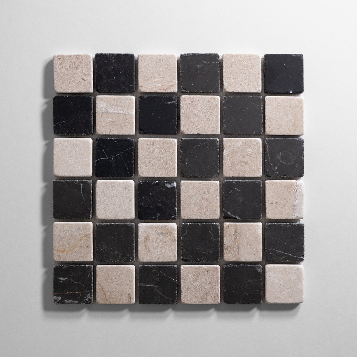 a Tumbled and beige and black checkered mosaic tile